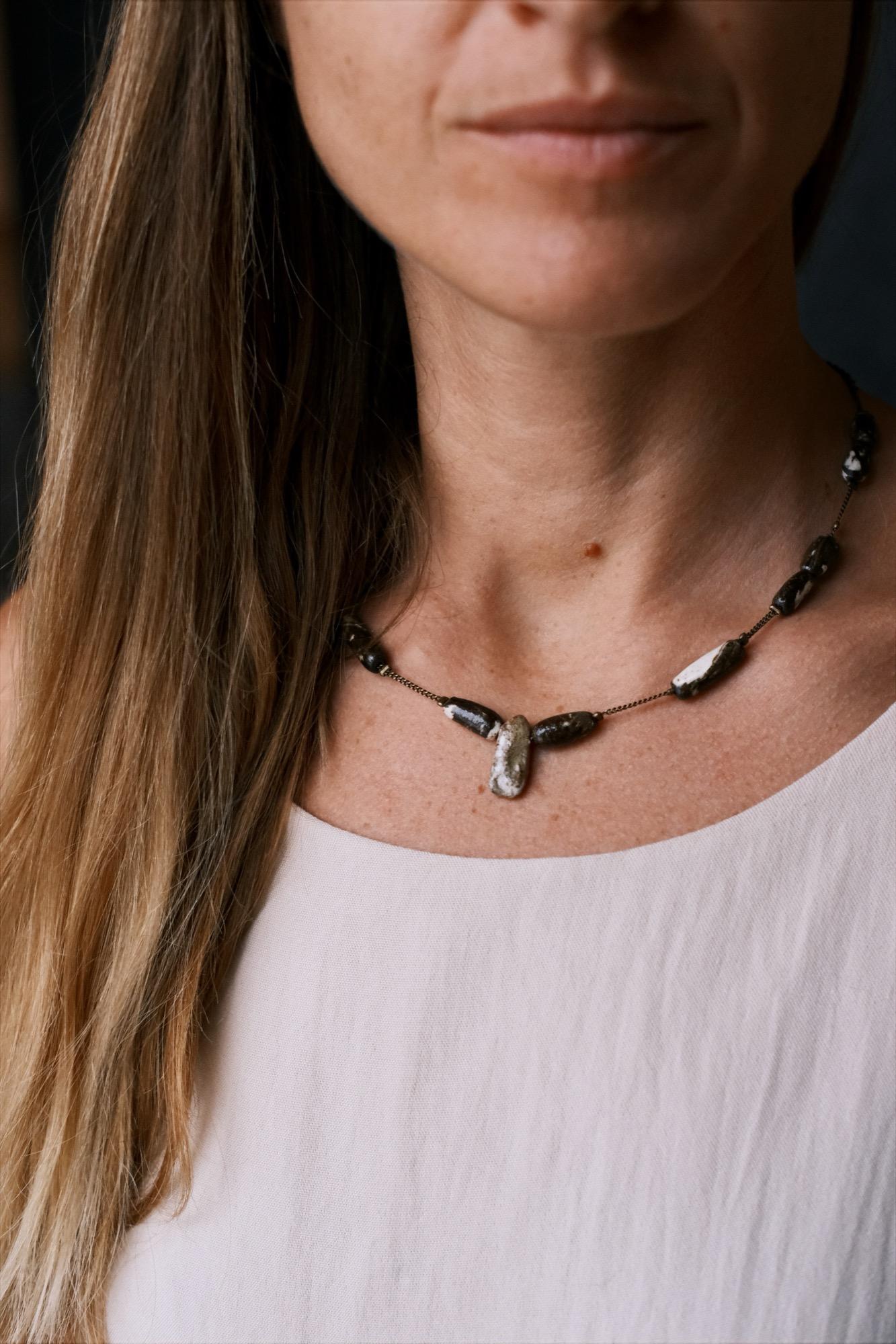 Stoneware jewelry on a workbench