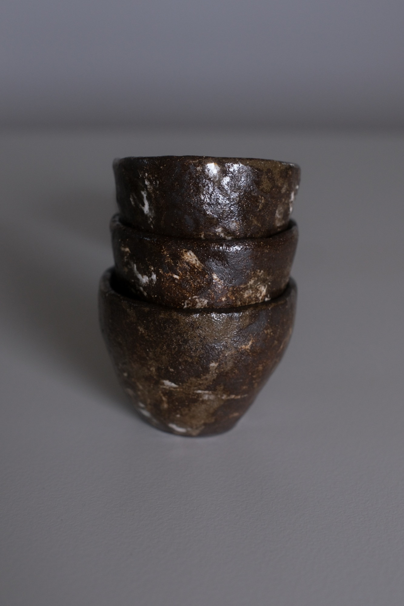 A handmade coffee cup, on the workbench